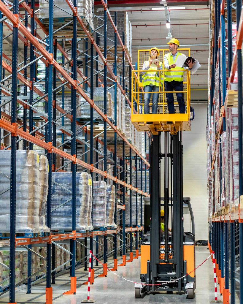 Forklift operators working on aerial boom lift truck