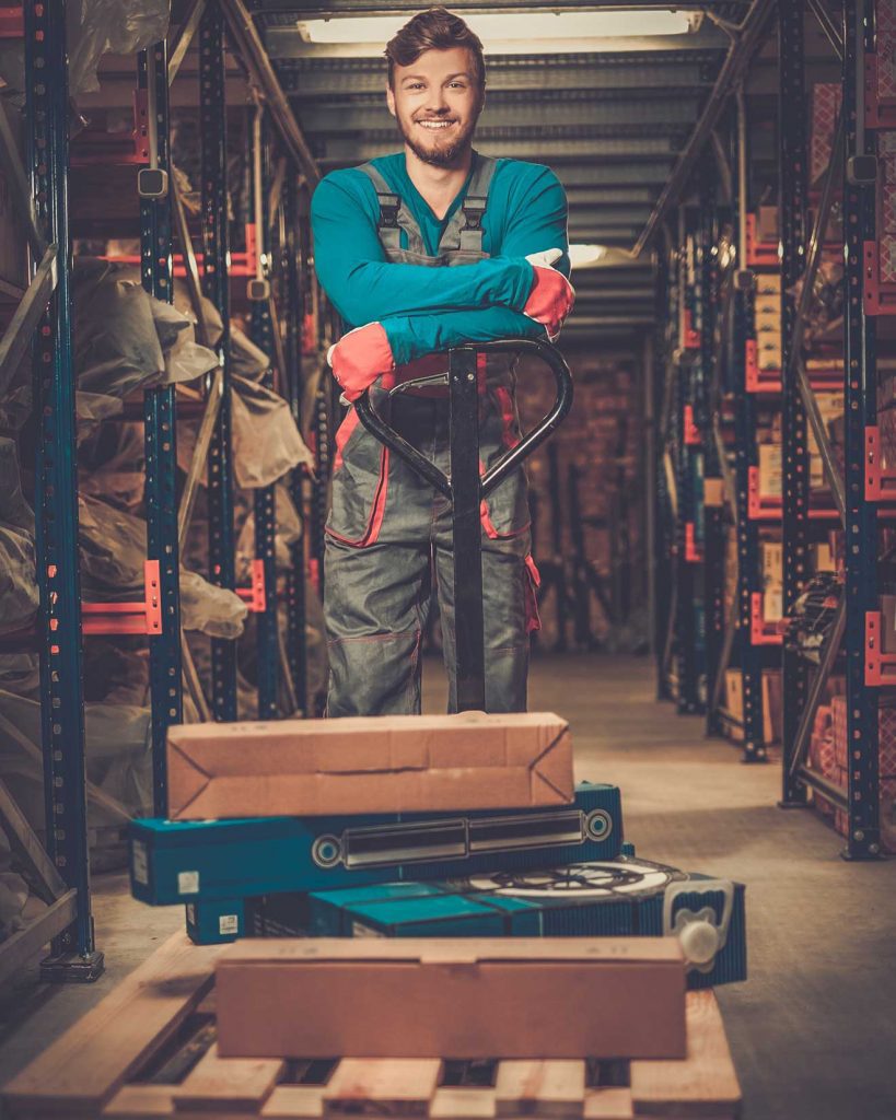 Forklift operator posing on order picker