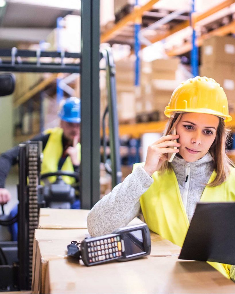 Women forklift operator talking over call