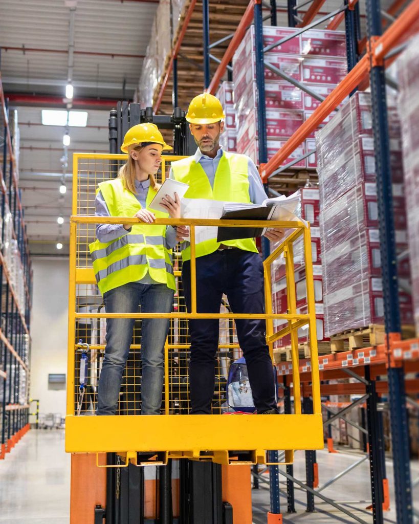 Two forklift operators discussing on Forklift